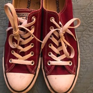 Converse classic burgundy low top sneakers.